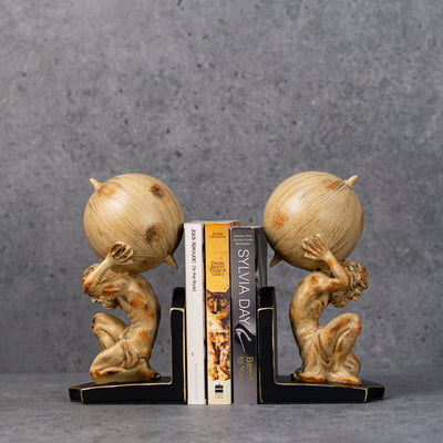 Man holding sphere bookends by Home 360