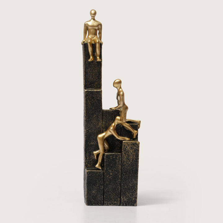 Motivational Gold & Black Figurines on Textured Steps
