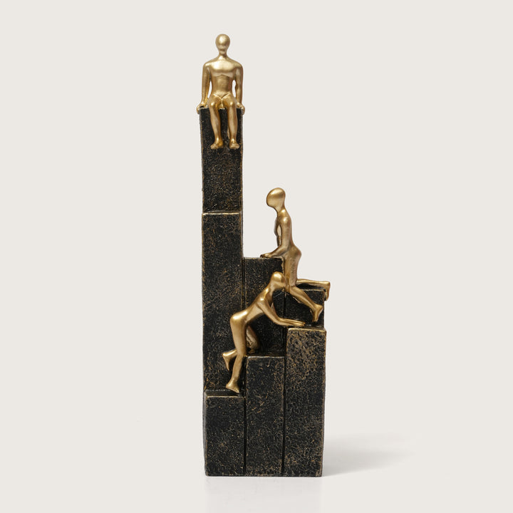 Motivational Gold & Black Figurines on Textured Steps