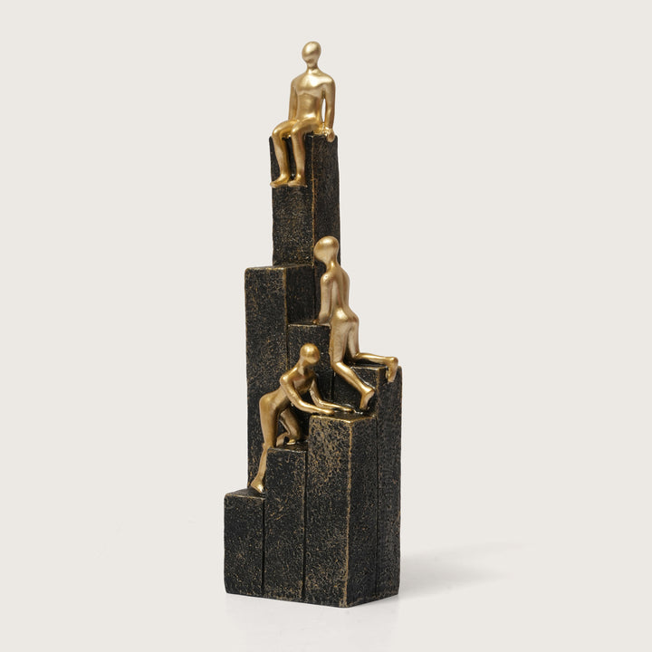 Motivational Gold & Black Figurines on Textured Steps