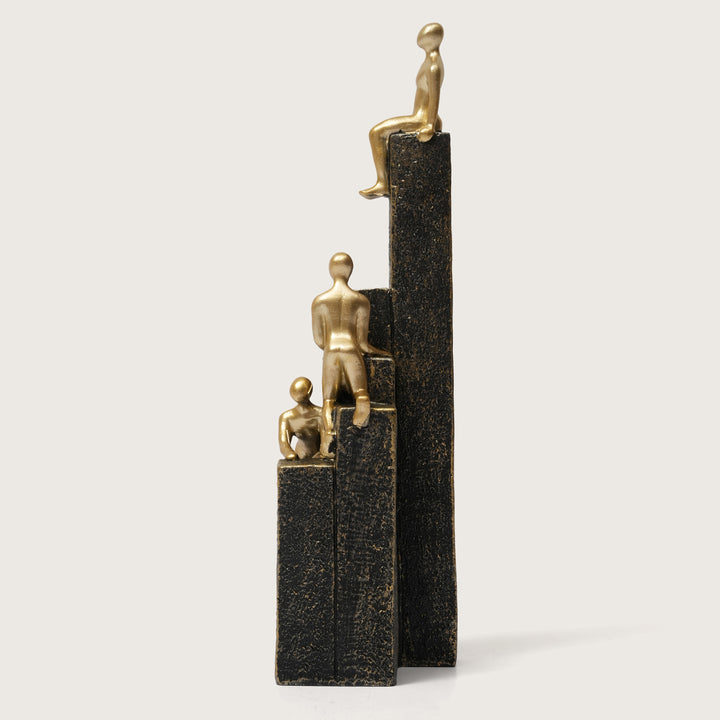 Motivational Gold & Black Figurines on Textured Steps