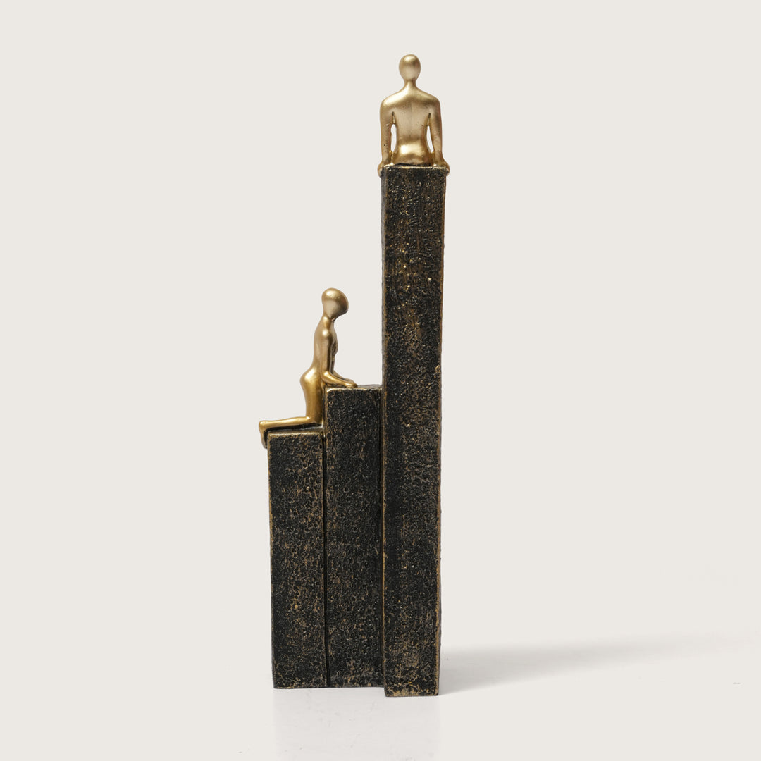 Motivational Gold & Black Figurines on Textured Steps