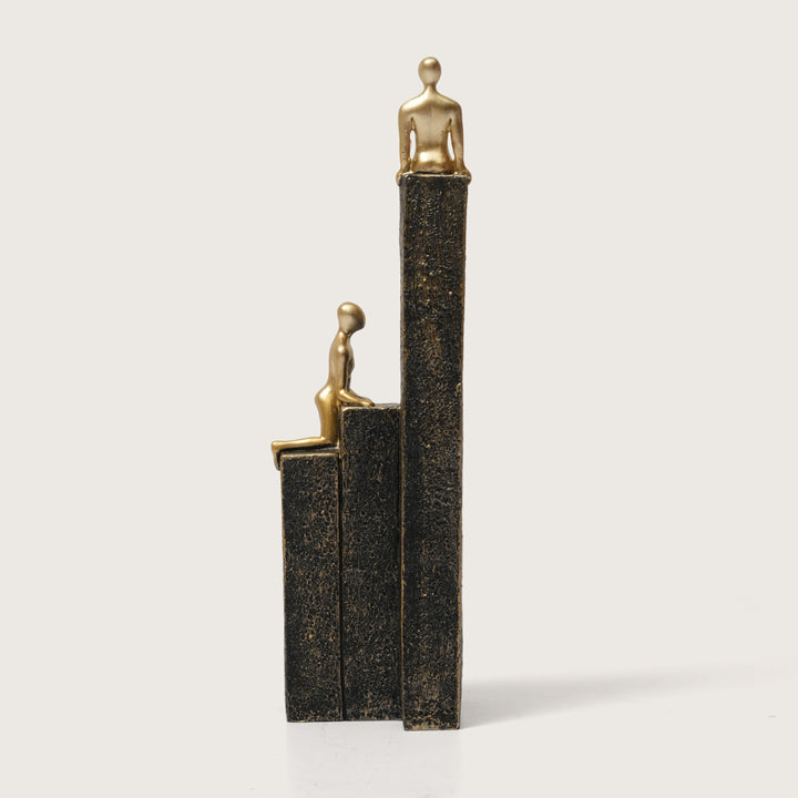 Motivational Gold & Black Figurines on Textured Steps
