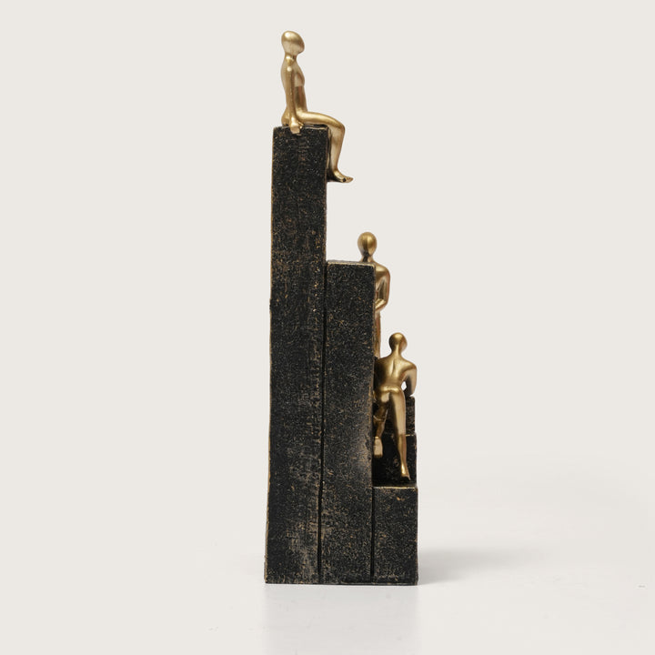 Motivational Gold & Black Figurines on Textured Steps