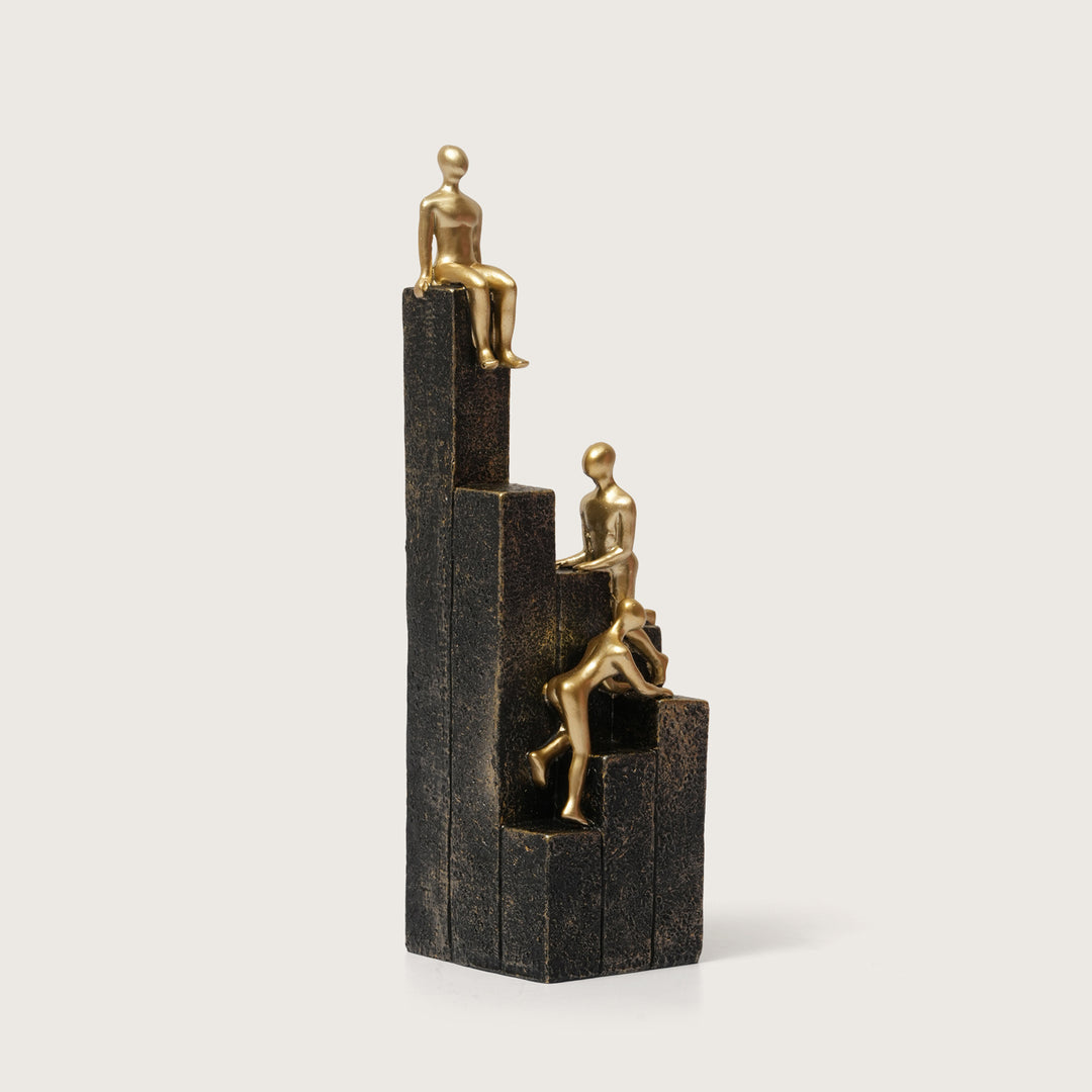 Motivational Gold & Black Figurines on Textured Steps
