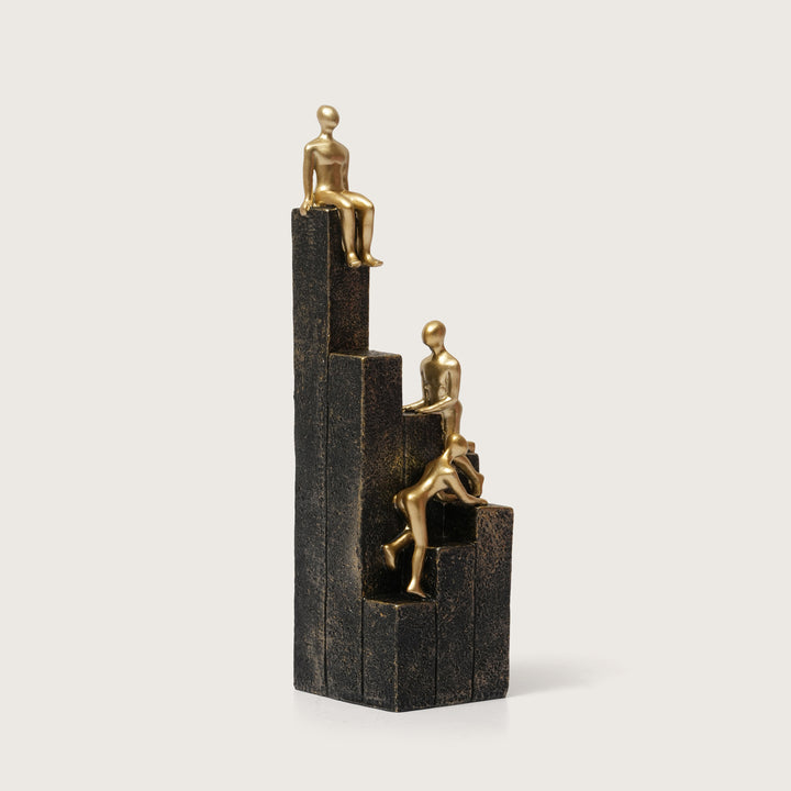 Motivational Gold & Black Figurines on Textured Steps