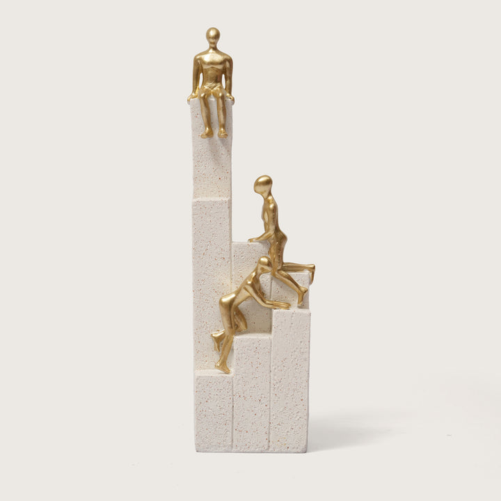 Motivational Gold & White Figurines on Textured Steps