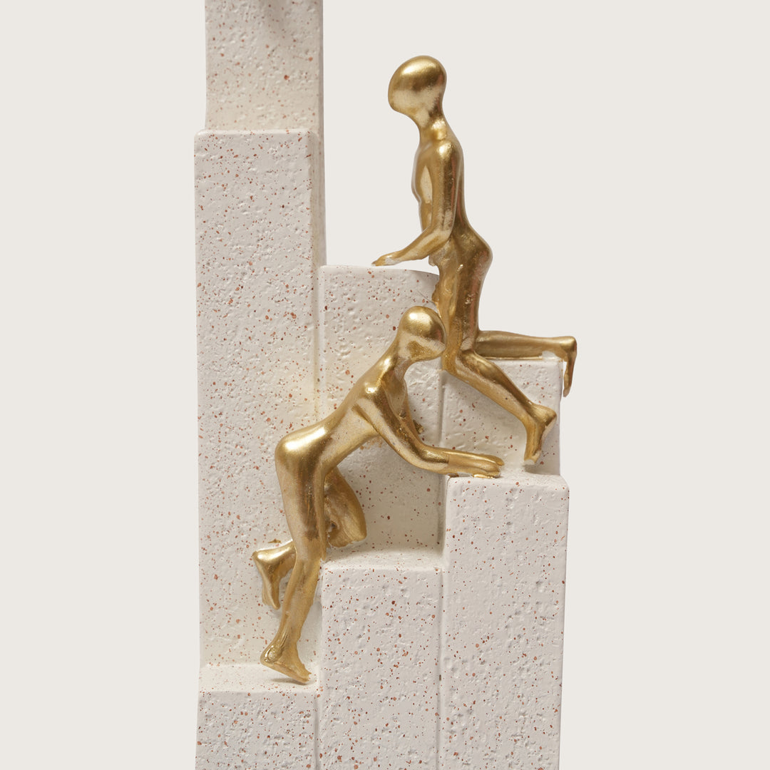 Motivational Gold & White Figurines on Textured Steps