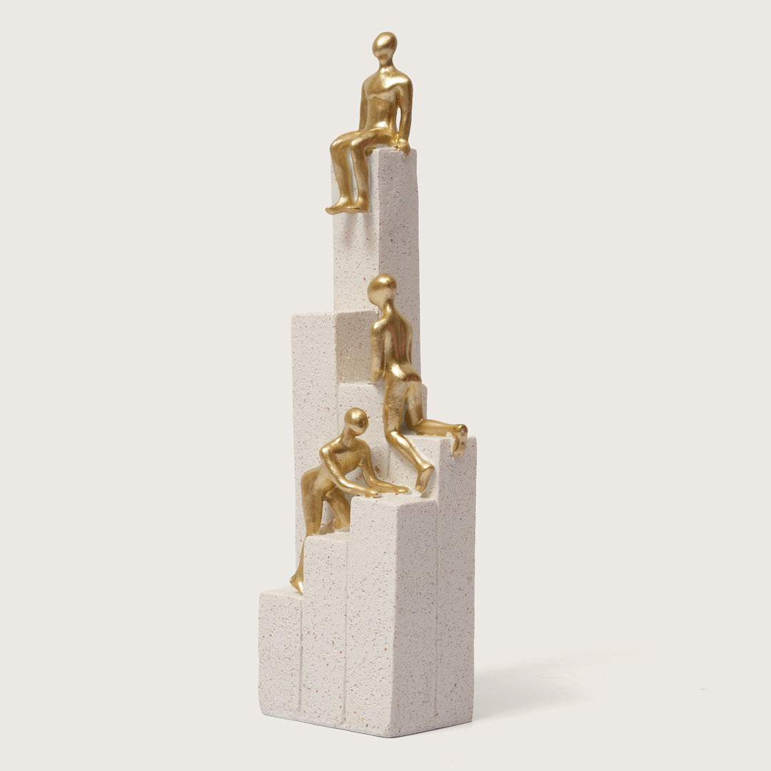Motivational Gold & White Figurines on Textured Steps