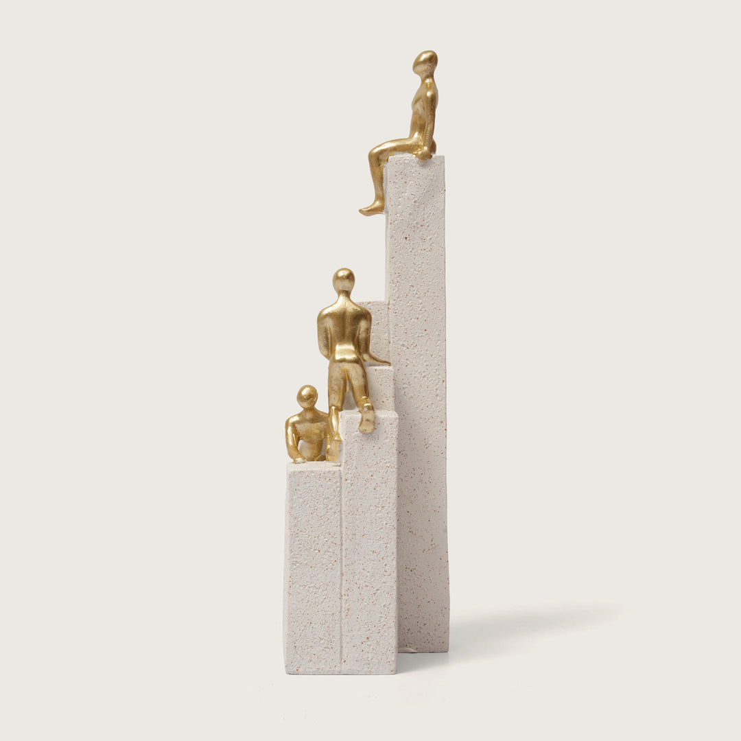 Motivational Gold & White Figurines on Textured Steps