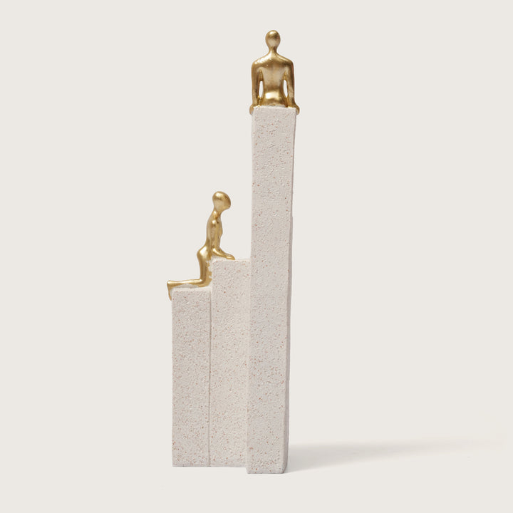 Motivational Gold & White Figurines on Textured Steps