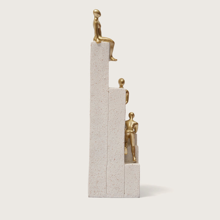 Motivational Gold & White Figurines on Textured Steps