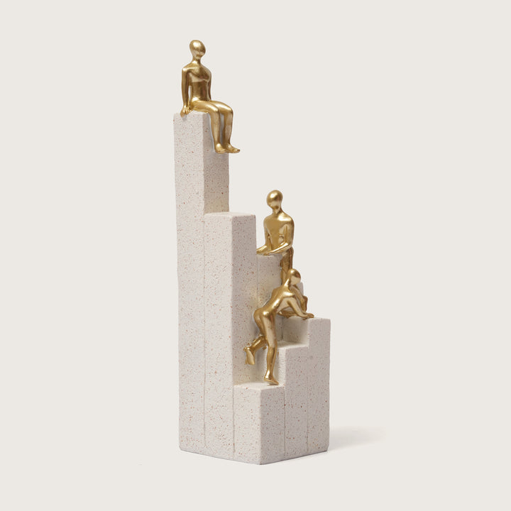 Motivational Gold & White Figurines on Textured Steps