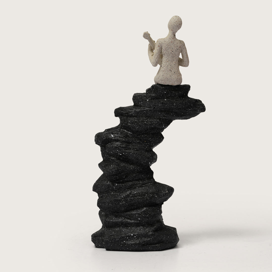 Abstract Guitarist Figurine on Stacked Black Rock Sculpture