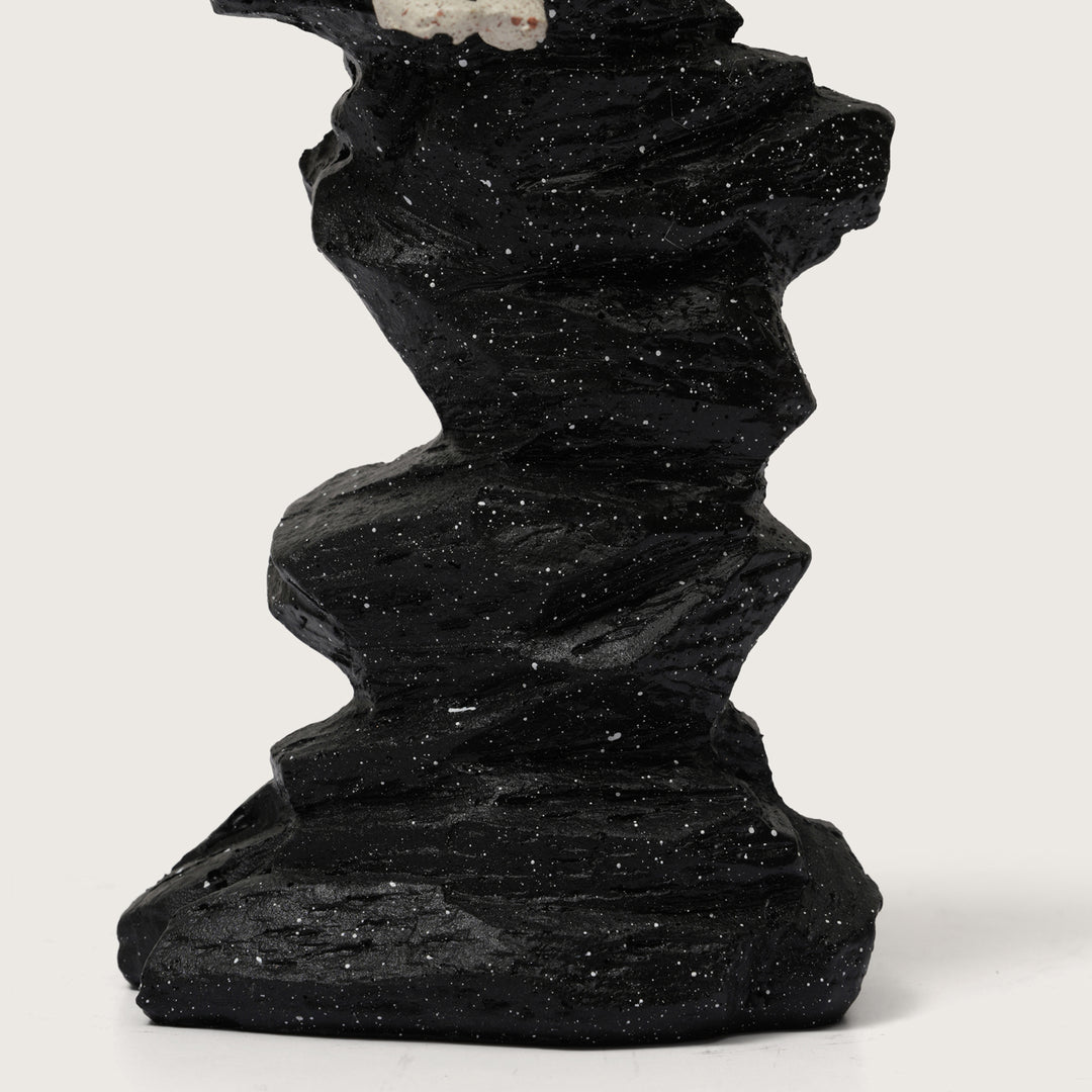Abstract Horn Player Figurine on Stacked Black Rock Sculpture