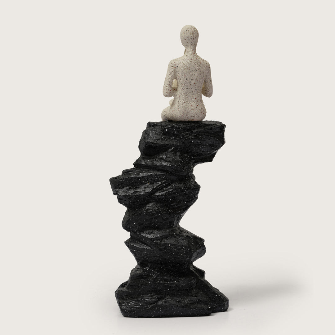 Abstract Horn Player Figurine on Stacked Black Rock Sculpture
