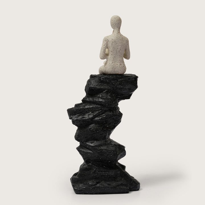 Abstract Horn Player Figurine on Stacked Black Rock Sculpture