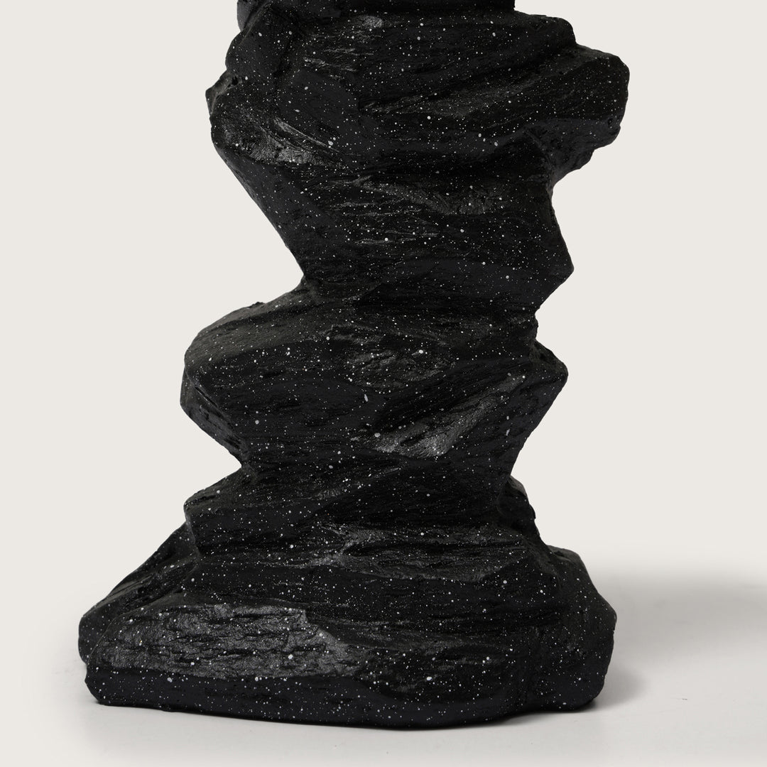 Abstract Drummer Figure on Black Stone Pillar Statue