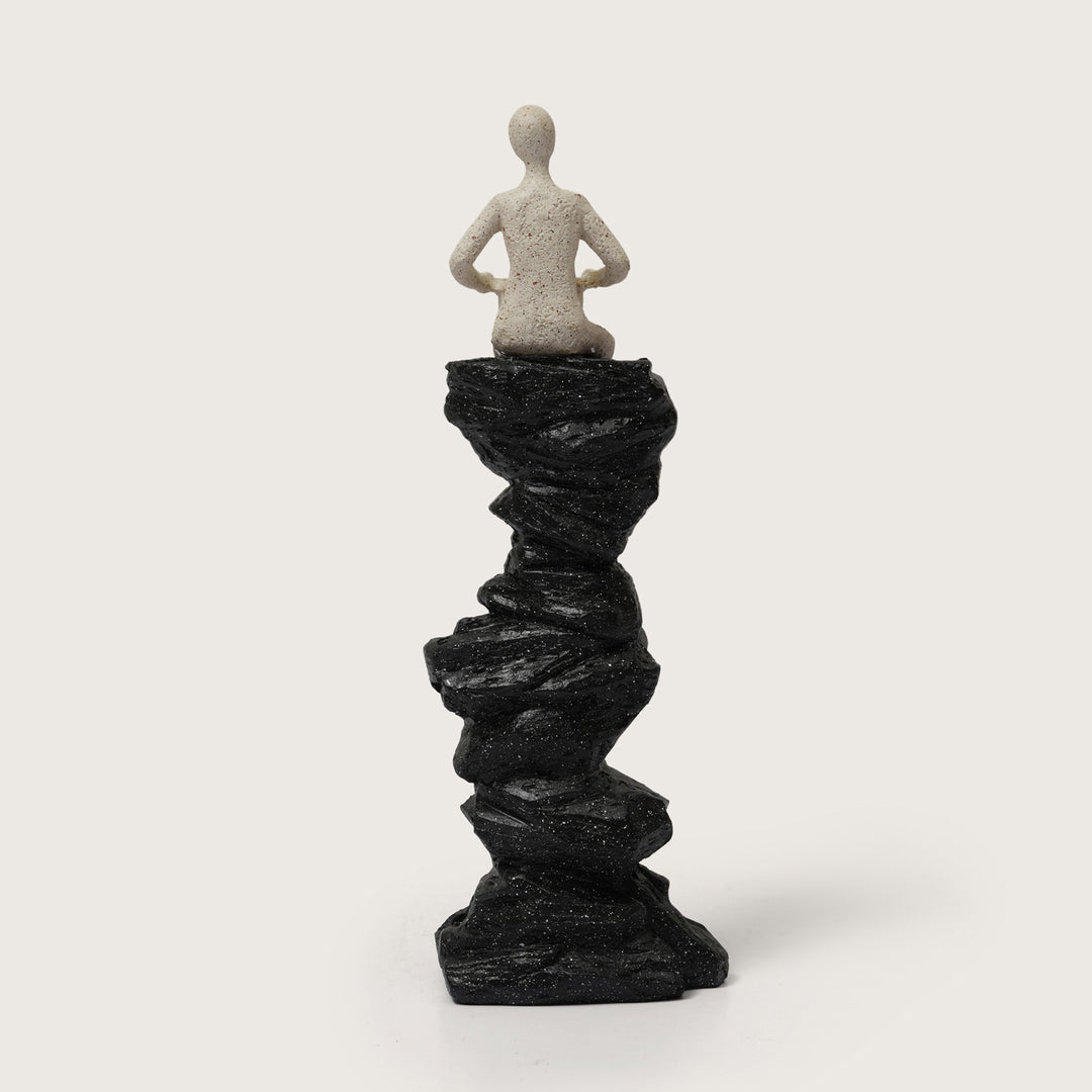 Abstract Drummer Figure on Black Stone Pillar Statue