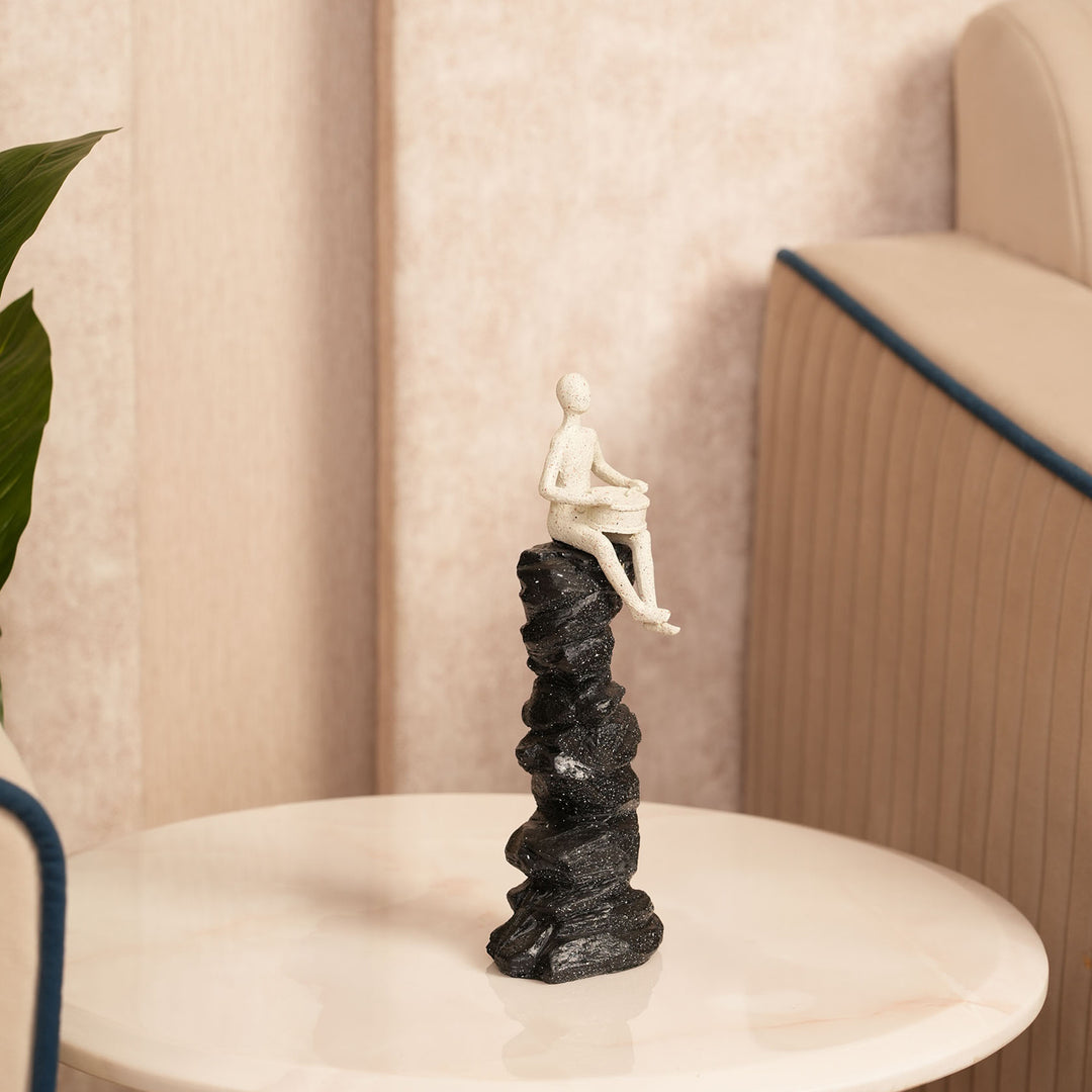 Abstract Drummer Figure on Black Stone Pillar Statue