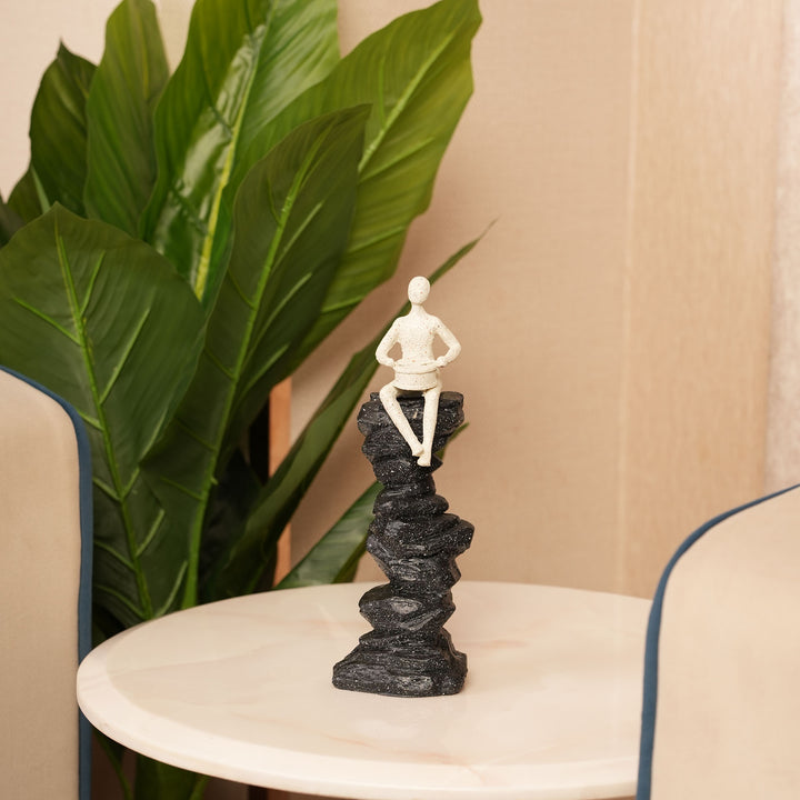 Abstract Drummer Figure on Black Stone Pillar Statue