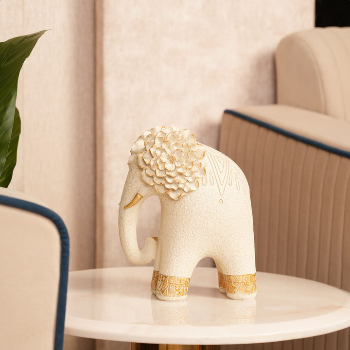 Textured Beige Elephant Sculpture with Gold Flower Headpiece