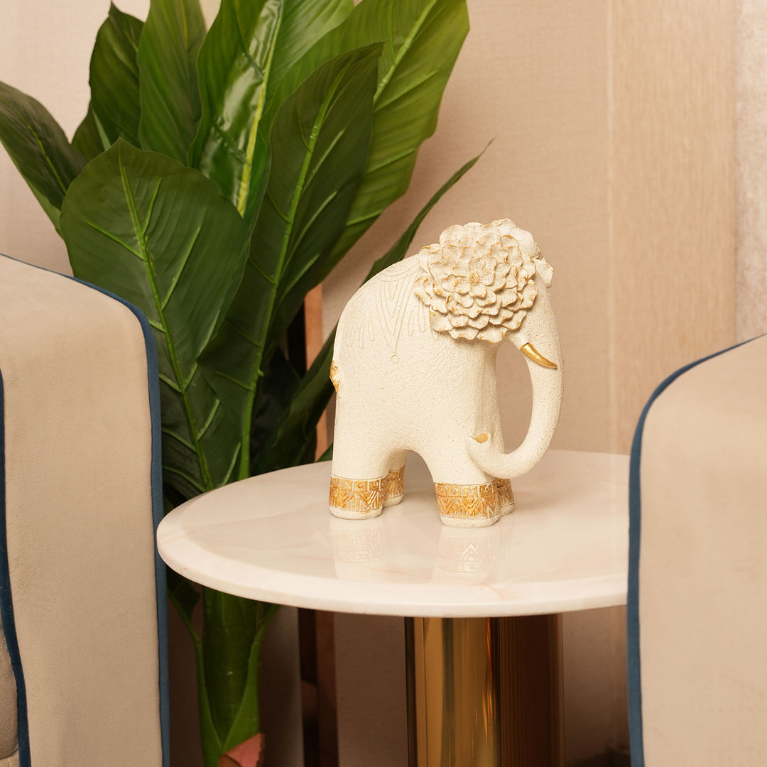 Textured Beige Elephant Sculpture with Gold Flower Headpiece
