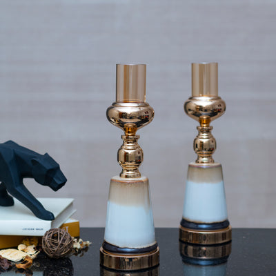Gold and off white candle stands by Home 360