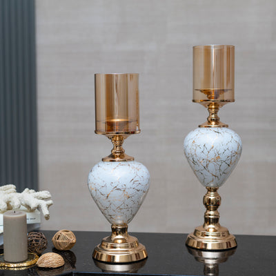 White and gold candle stands by Home 360
