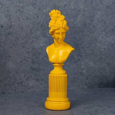 Yellow lady statue by Home 360