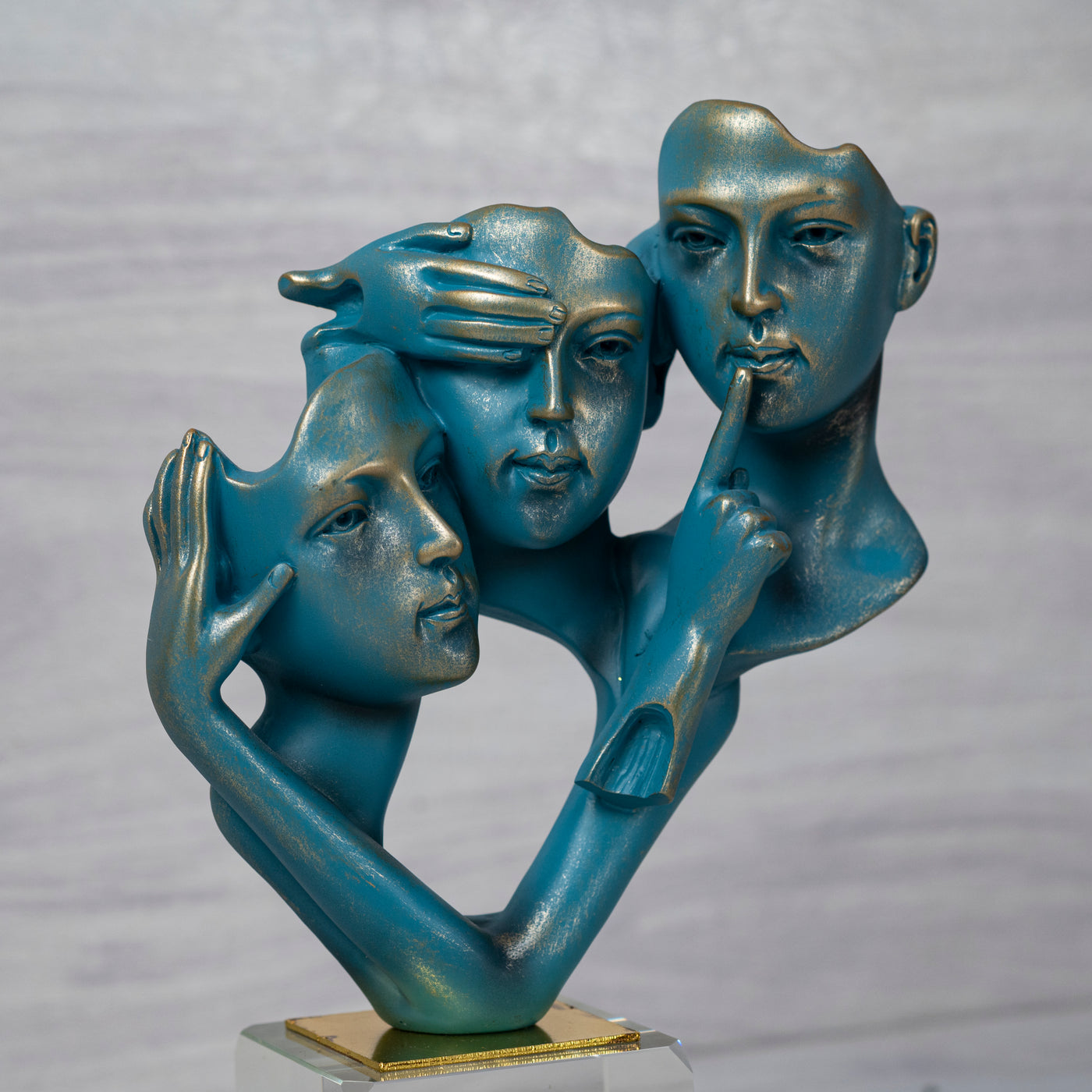 Teal faces statue by Home 360