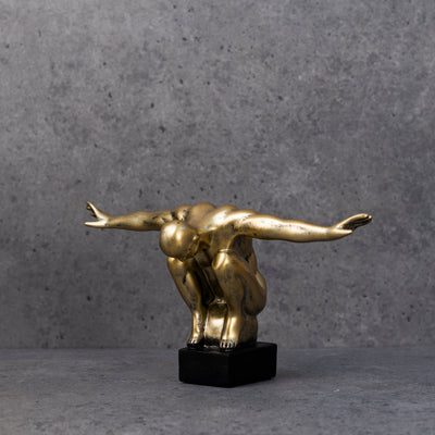 Gold diver statue by Home 360