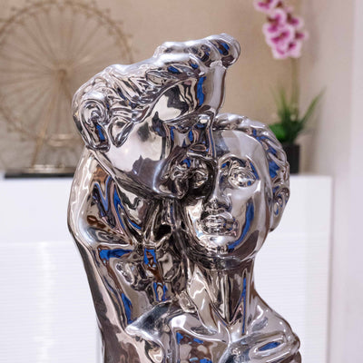 Couple hugging silver statue by Home 360
