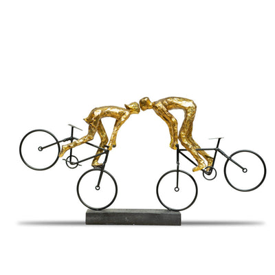 Golden cyclists statue by Home 360
